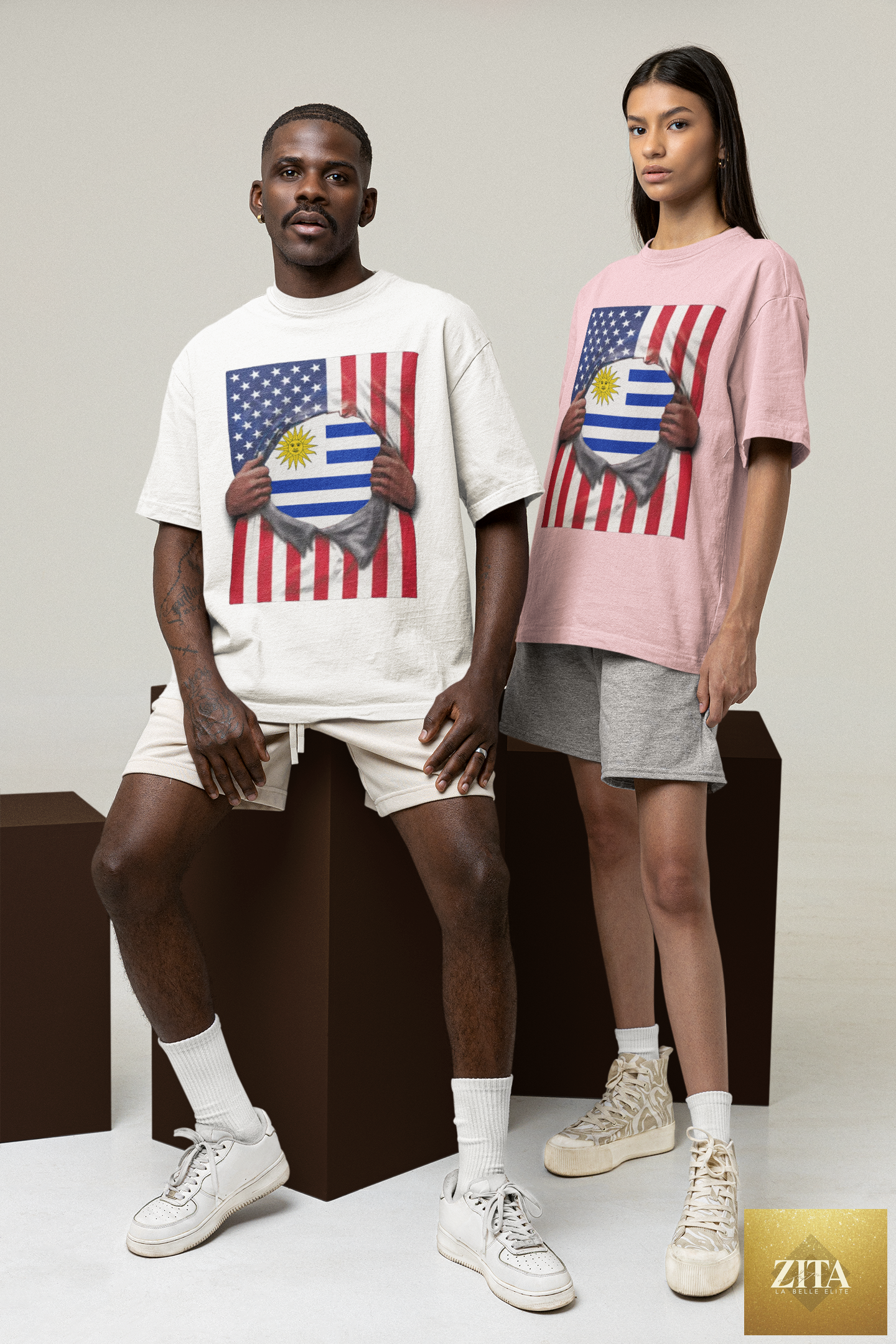 Man and woman wearing Uruguay and USA flag pride T-shirts by Latinos 4 The World, featuring customizable sleeves in a studio setting.