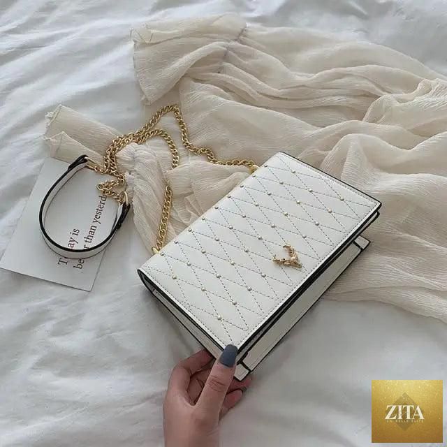 Elegant Stevvex genuine leather crossbody bag with designer chain strap, showcasing a sleek modern design for women and girls.