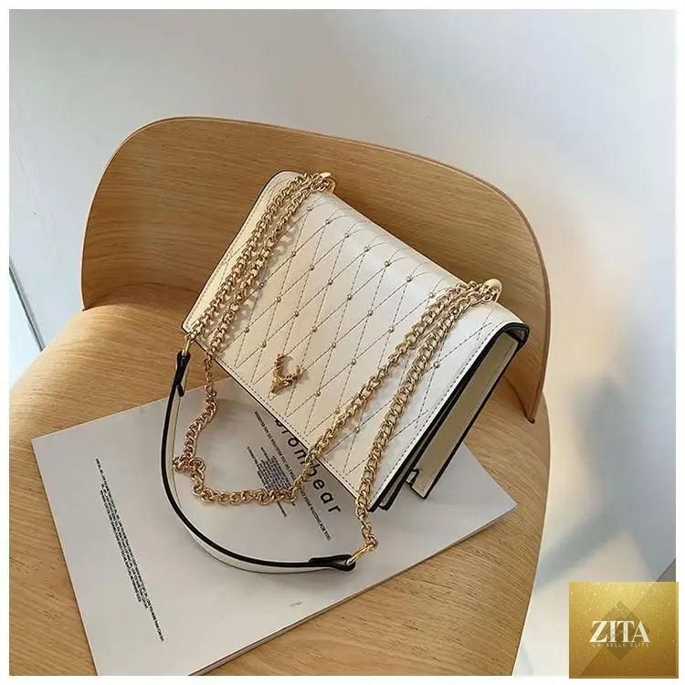 Elegant Sterling Pu leather crossbody bag by Stevvex with designer chain strap, suitable for women and girls, stylish and modern.