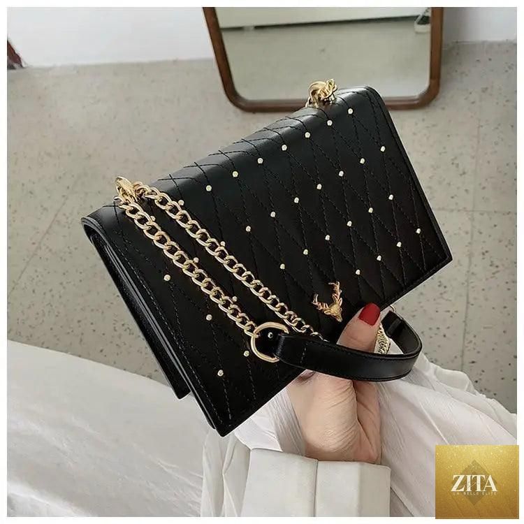 Elegant Stevvex genuine leather crossbody bag for women with designer chain strap, featuring a sleek and modern design.
