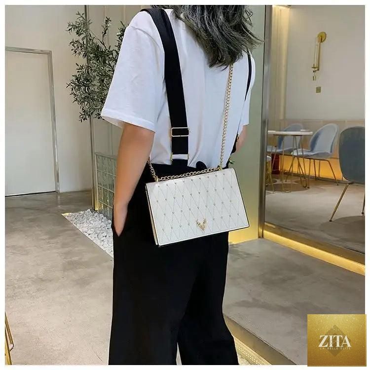Elegant Stevvex genuine leather crossbody bag with designer chains, suitable for women and girls, featuring a modern luxury style.