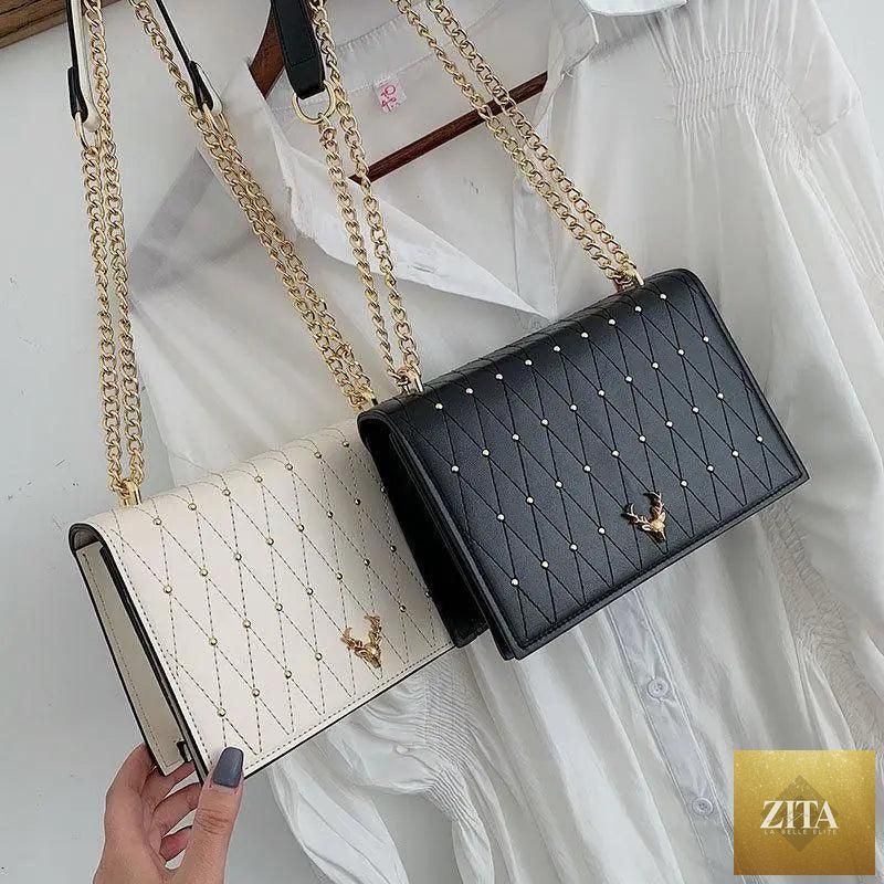 Elegant Stevvex genuine leather crossbody bag for women with designer chain strap, showcasing a sleek modern and luxurious style.