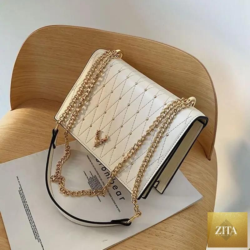 Elegant Sterling PU leather crossbody bag for women featuring a designer chain strap and sleek, modern style.