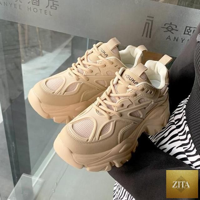 White modern thick platform sneakers for women by Stevvex, lace-up vulcanized shoes with a stylish, comfortable, lightweight design.