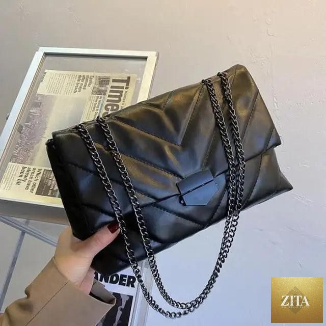 Elegant genuine leather Stevvex women's crossbody handbag with a casual chain strap and simple shoulder design.