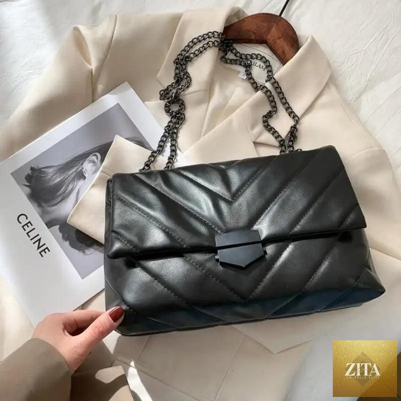 Elegant Stevvex genuine leather crossbody bag for women, featuring a casual chain strap and simple shoulder bag design.