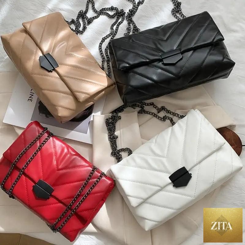 Elegant genuine leather Stevvex women's crossbody handbag with a casual chain strap and simple shoulder design.