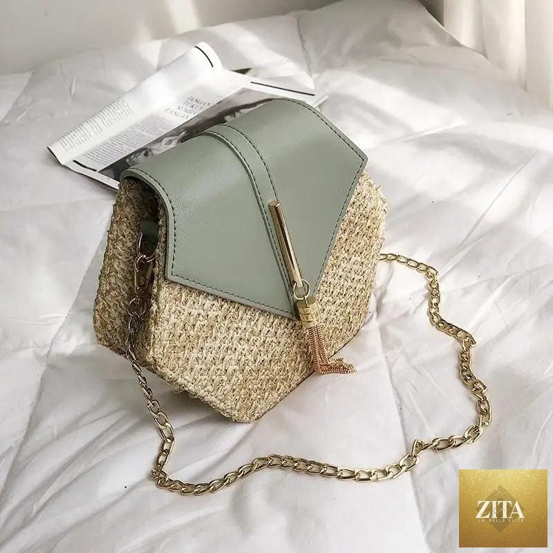 Elegant genuine leather handbag with straw and leather details, featuring a circular design, perfect for women and girls.