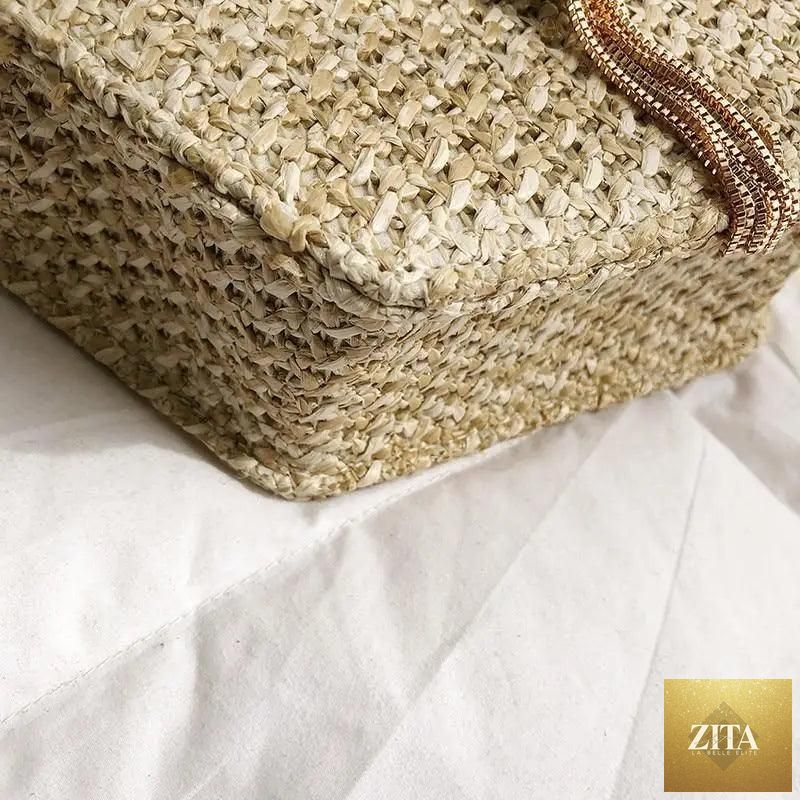 Elegant genuine leather handbag by Stevvex featuring a woven straw and leather design, perfect for women and girls on summer outings.