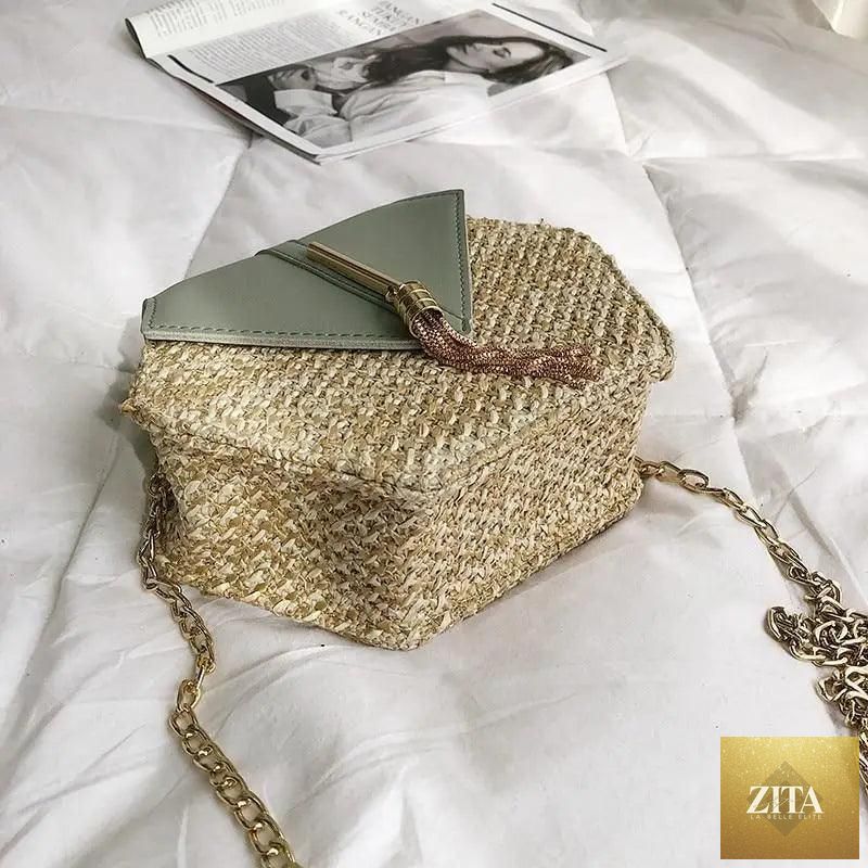 Elegant genuine leather handbag by Stevvex featuring a woven straw and leather design, perfect for summer beach and casual outings.
