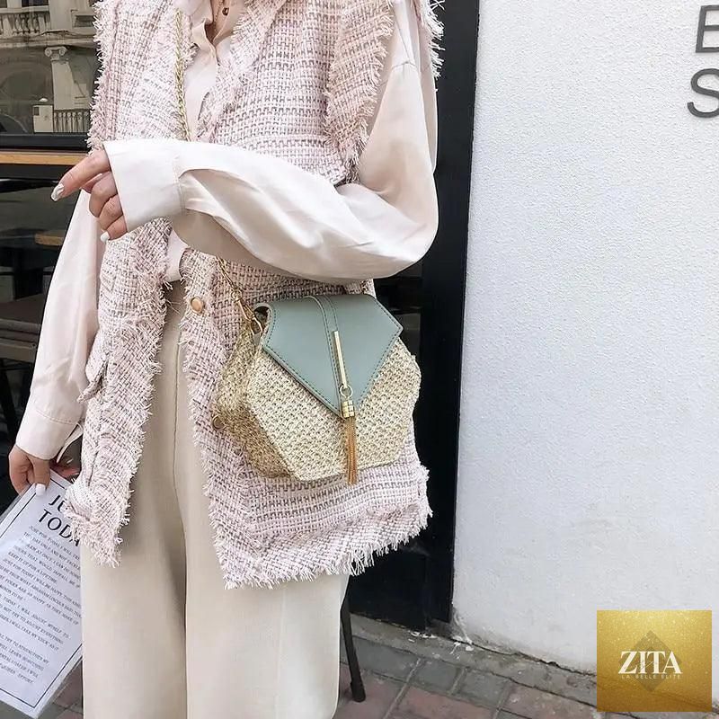 Elegant genuine leather handbag with straw and leather woven design, featuring a circular summer beach shoulder bag for women and girls.