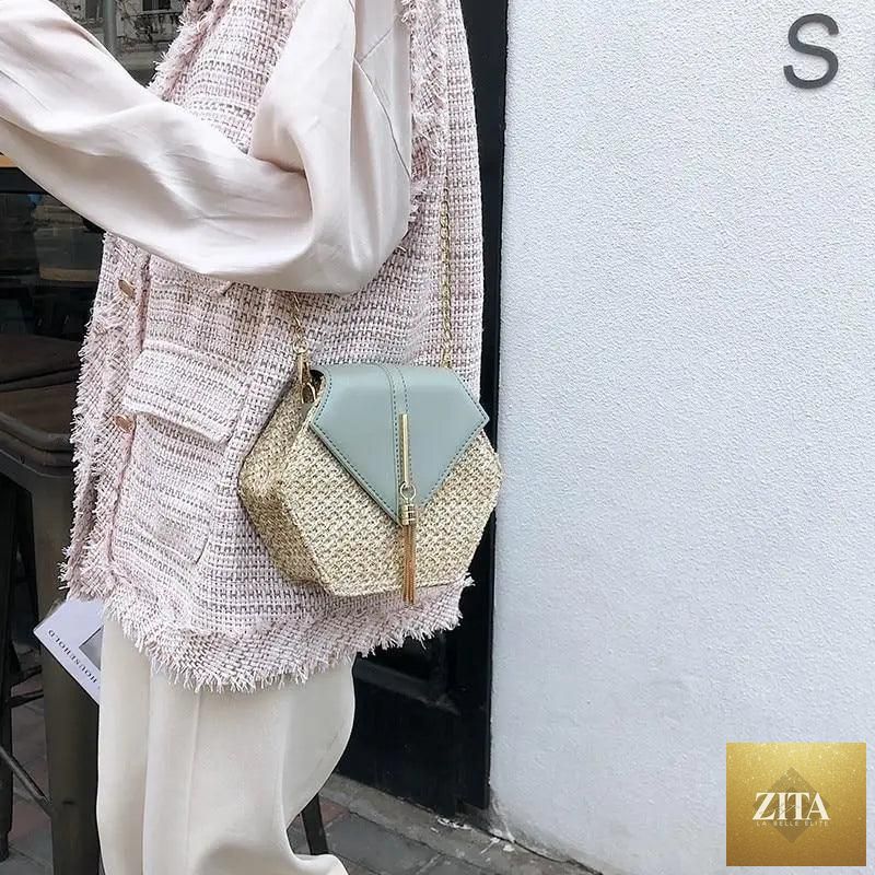 Elegant genuine leather handbag with straw and leather woven design, featuring a circle shoulder style for women and girls.