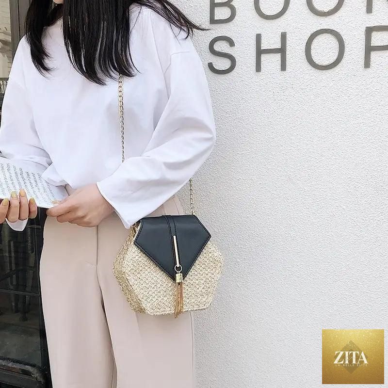 Elegant genuine leather handbag with straw and leather woven design, perfect for women and girls, featuring a circular shoulder style.
