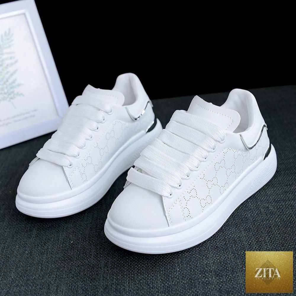 Women's white Stevvex sports shoes with thick soles, breathable fabric, lace-up design, ideal for gym, running, and casual wear.