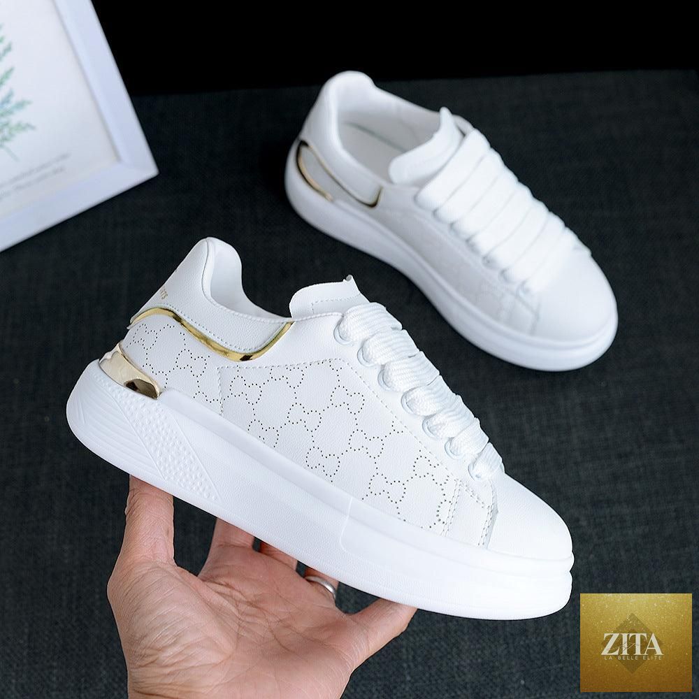 Women's white Stevvex sports sneakers with thick soles, breathable fabric, lace-up design, suitable for gym, running, and casual wear.
