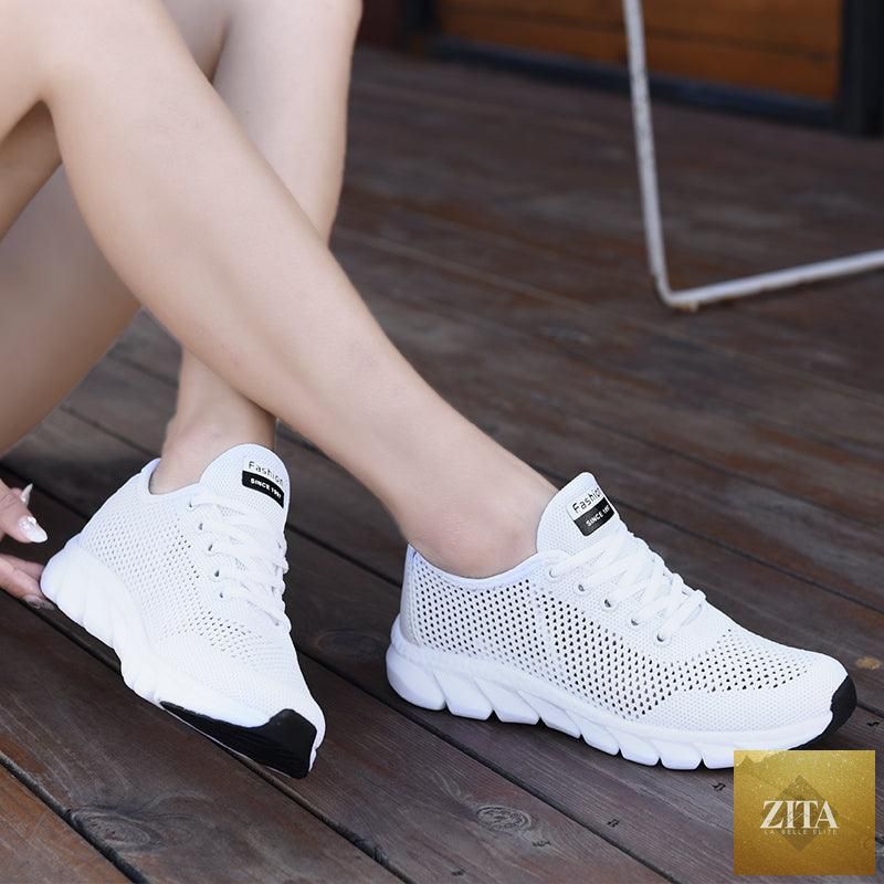 Stevvex women's mesh breathable flat sneakers with lightweight design, non-slip soles, ideal for running and walking.