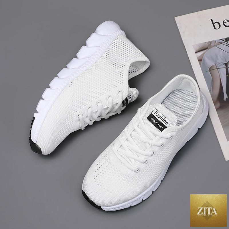 Stevvex women's breathable mesh sneakers with flat design, lightweight, non-slip soles, ideal for running and walking.