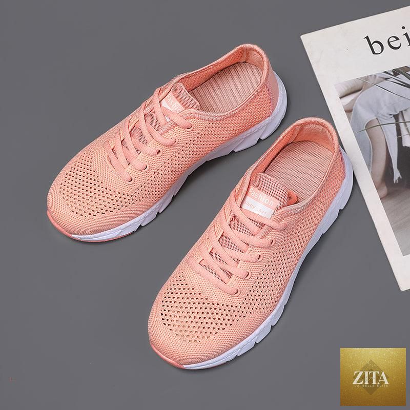 Stevvex women's breathable mesh sneakers with flat design, lightweight, non-slip soles, ideal for walking and running.