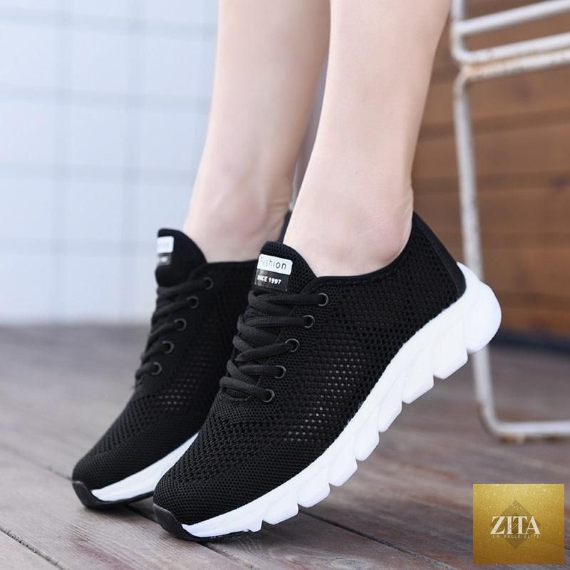 Stevvex women's breathable mesh sneakers with flat design, lightweight, non-slip soles, ideal for running and walking.