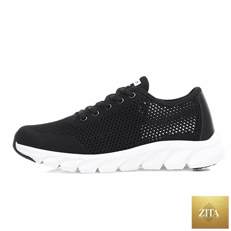 Pair of Stevvex breathable mesh women's sneakers with flat design, lightweight construction, non-slip soles, suitable for walking and running.