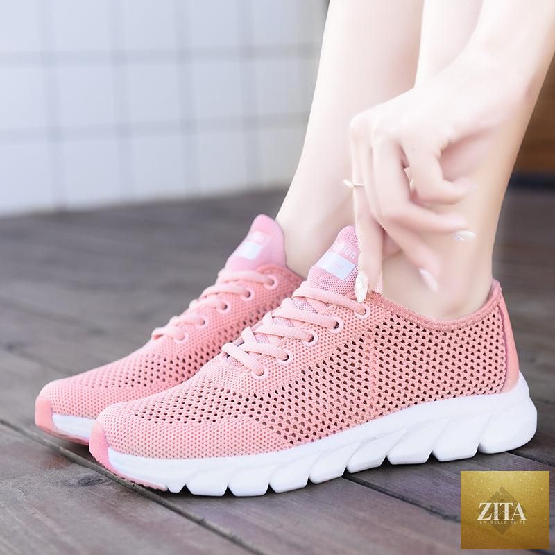 Stevvex women's mesh breathable flat sneakers with lightweight design, non-slip soles, ideal for running and walking.