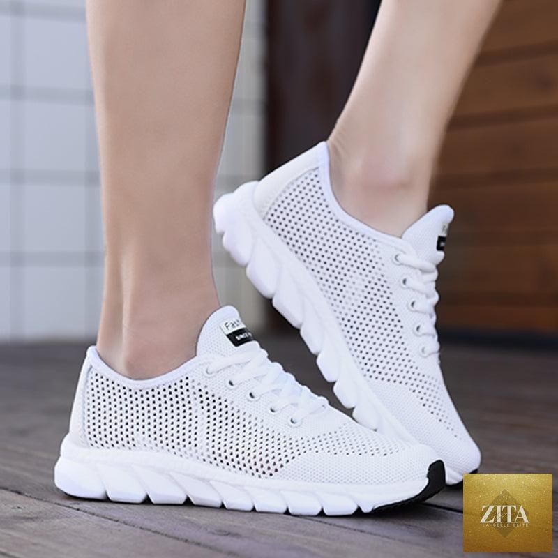 Stevvex women's mesh breathable flat sneakers with lightweight design, non-slip soles, suitable for running and walking.