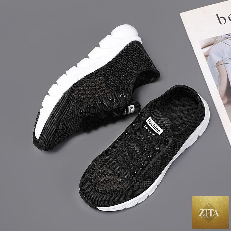 Stevvex breathable mesh women's sneakers with flat design, lightweight, non-slip sole, ideal for walking and running.