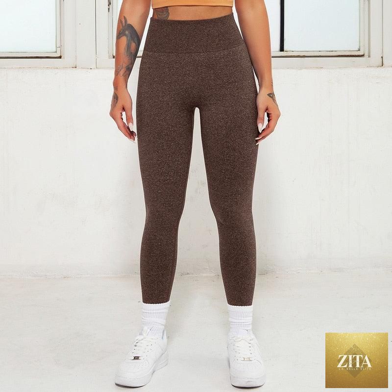 Pink seamless women’s leggings with high waist, gym workout design, and lifting support, ideal for yoga, fitness, and active wear.