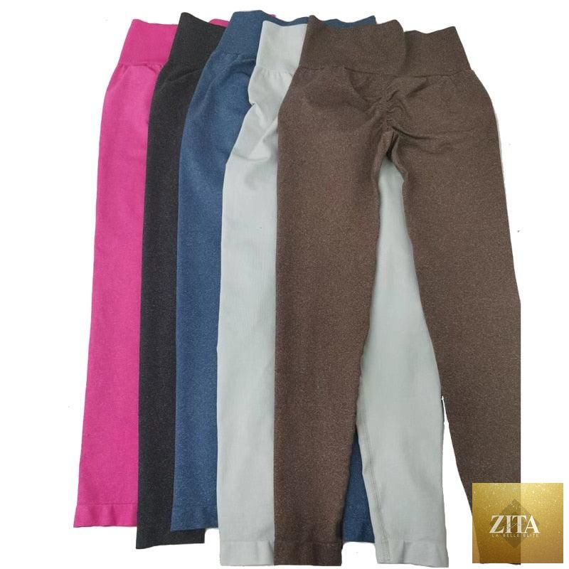 Pink seamless women's leggings for workout, high waist yoga pants, sporty fitness activewear, designed for comfort and support.