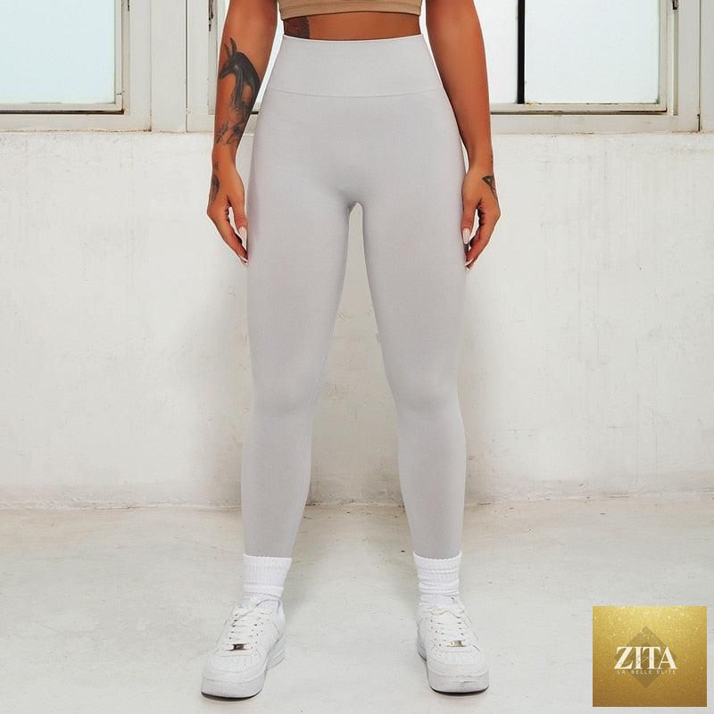 Pink seamless women's leggings by Stevvex, high waist yoga pants, suitable for gym workouts, fitness, and active wear.