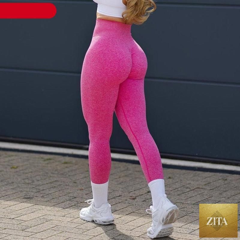 Pink seamless workout leggings for women, high waist yoga pants with push-up and lifting features, ideal for fitness and active wear.