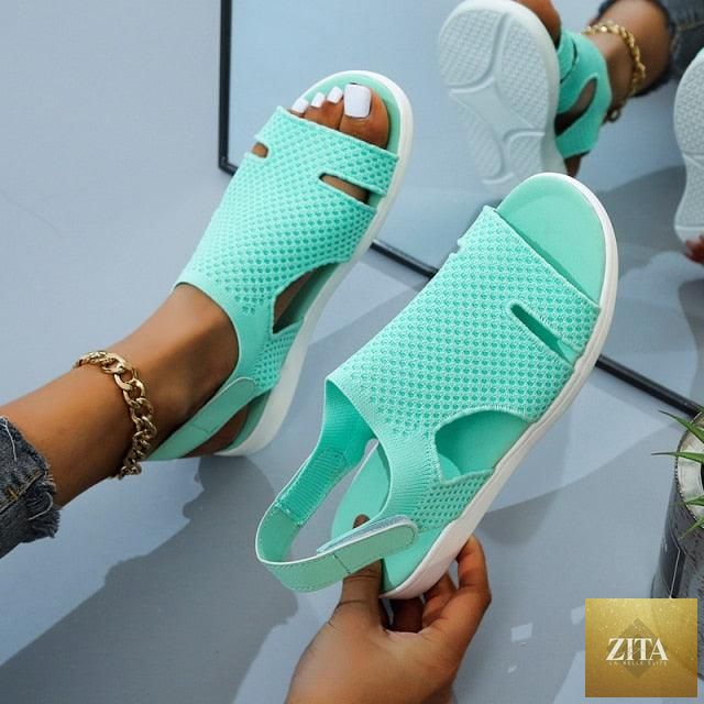 Blue casual women’s summer sandals by Stevvex with buckle strap, open toe, slip-on flat design, perfect for beach or dressy casual wear.