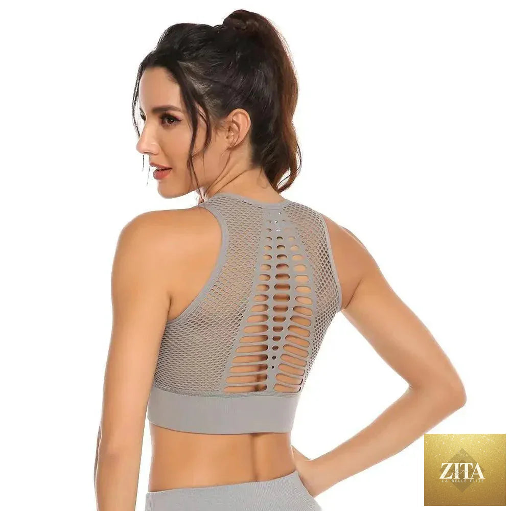 Stevvex women's backless solid quick-dry workout T-shirt and sports bra for yoga, running, and gym activities.