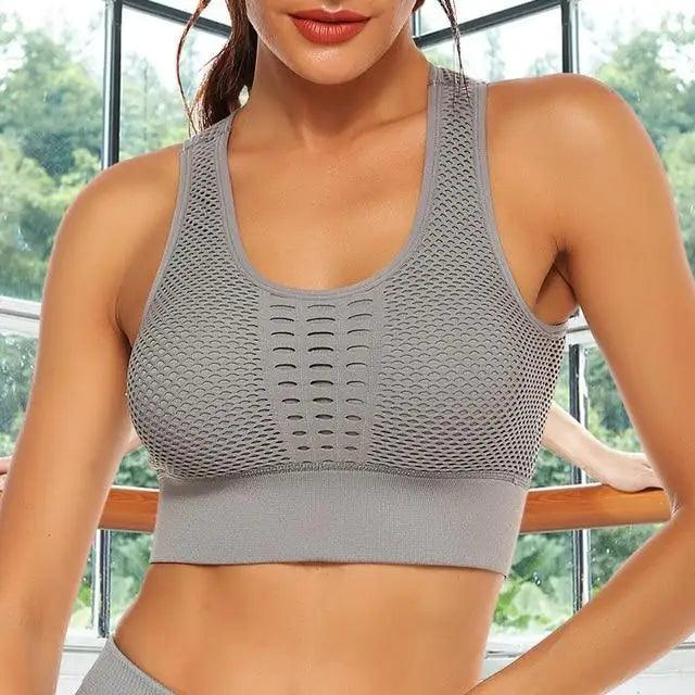Stevvex women's backless solid workout t-shirt and yoga vest, quick-dry sports bra for running and gym activities.