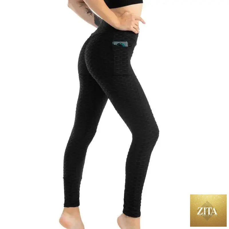 Stevvex women's high-waist fitness leggings with pockets, designed for running and gym workouts, featuring a push-up style fit.