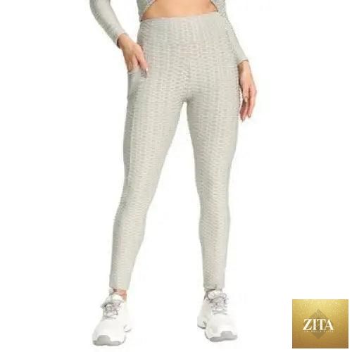 Stevvex women’s high-waist fitness leggings with pockets, designed for push-ups, running, and gym workouts.