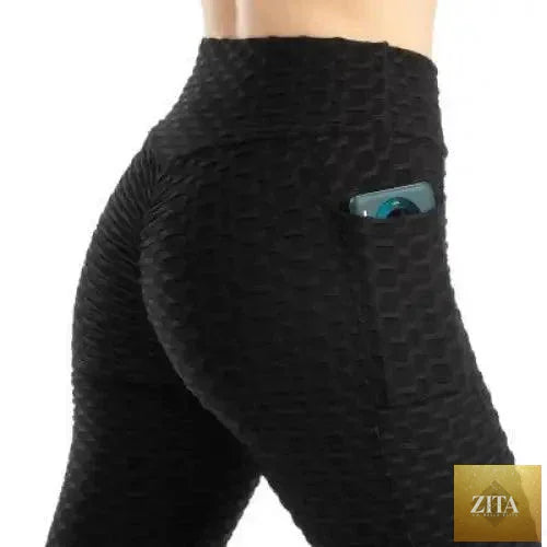 Stevvex women's high waist push-up leggings with pockets, ideal for fitness, running, and gym workouts in a sleek black design.