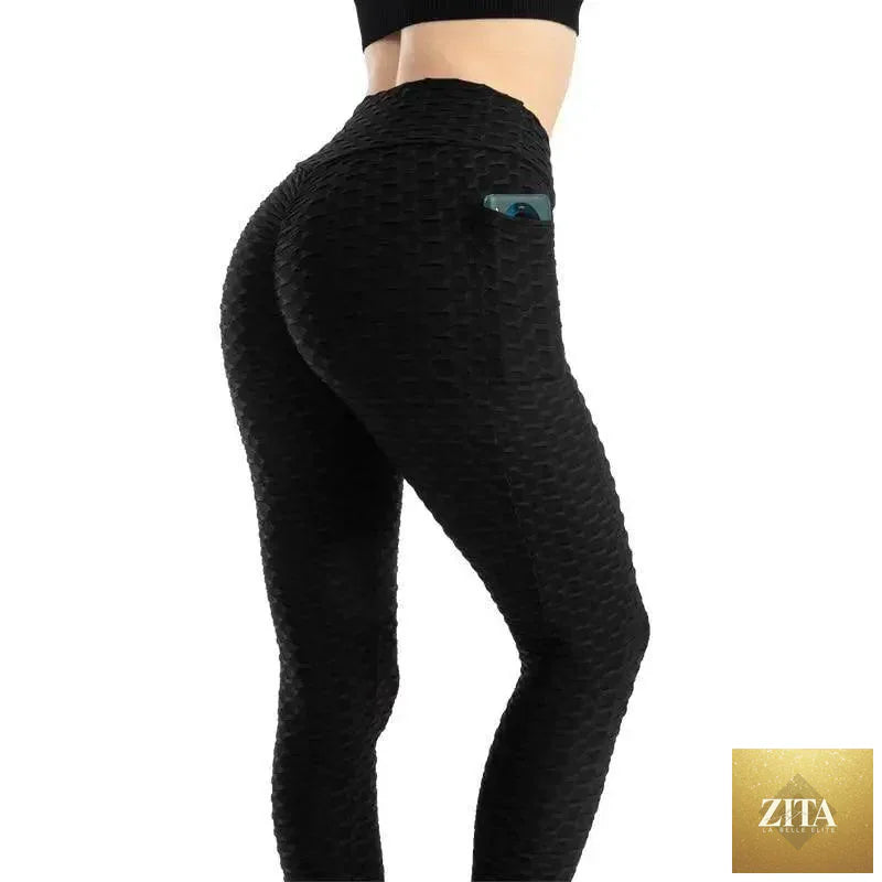 Stevvex women's high-waist push-up leggings with pockets, suitable for running and gym workouts, in black with a sleek fit.