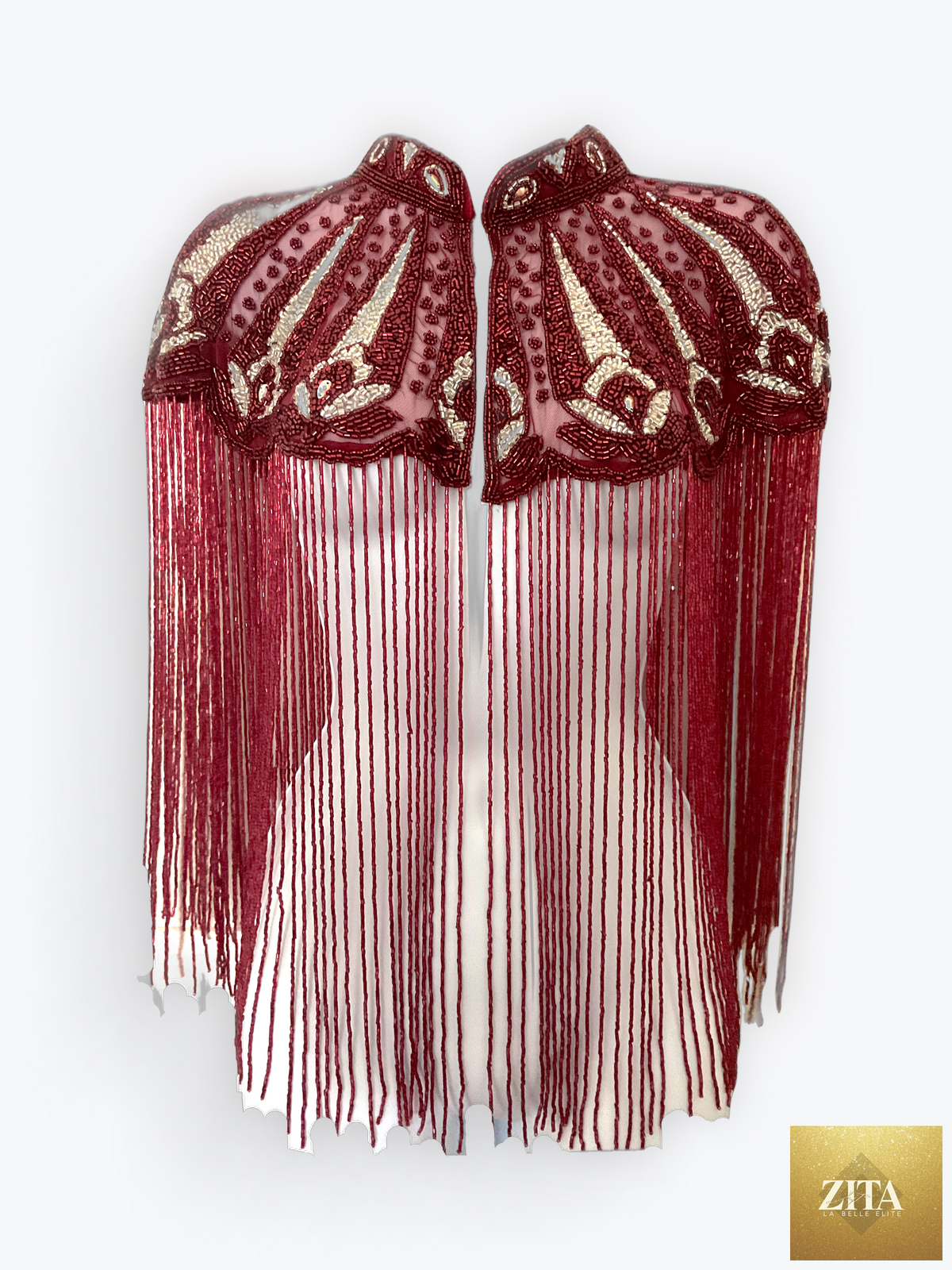 L'Jai Amor Cherry Peacock Cape featuring vibrant cherry and peacock feather design, elegant flowing fabric with intricate details.