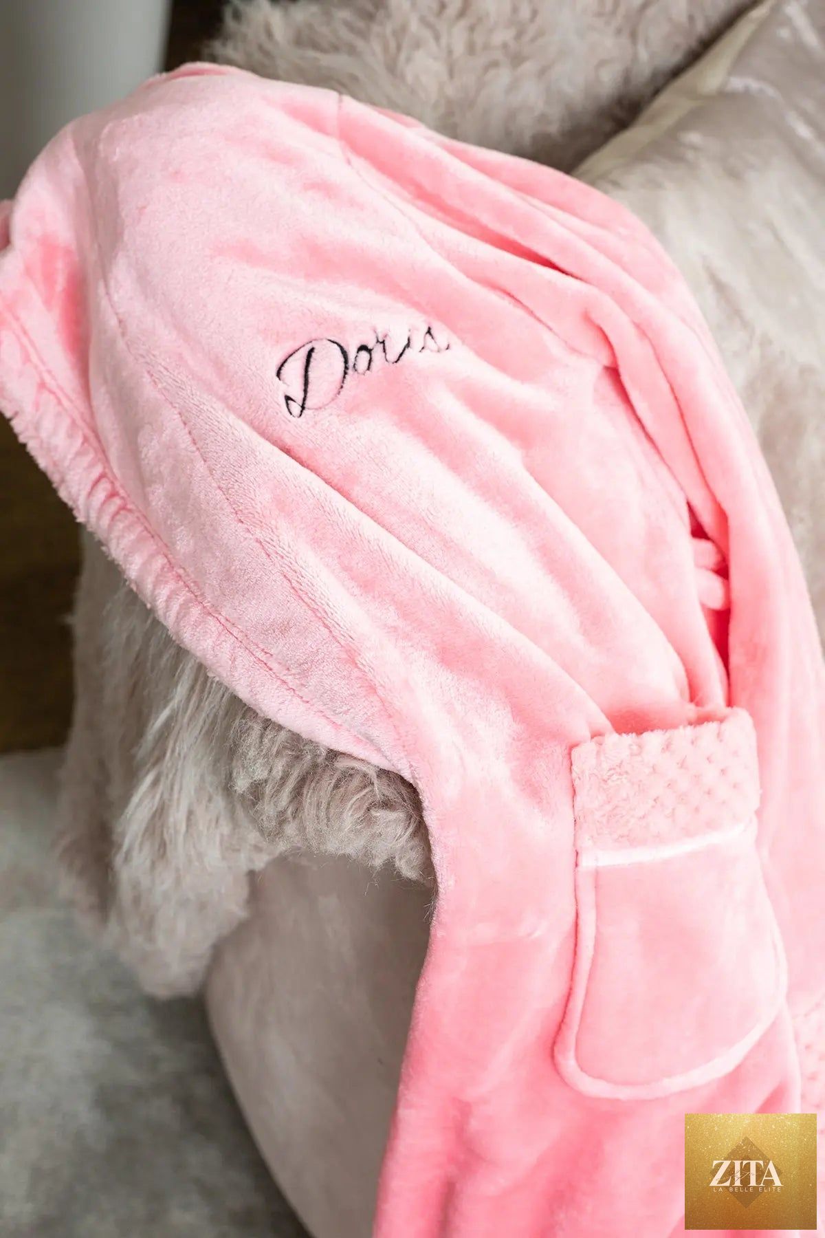 Women's plush bathrobe by Lotus Linen featuring a personalized design, soft fleece material, and cozy, relaxed fit.