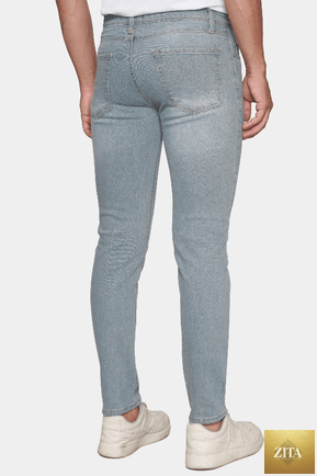 Bright Moons The Classic Jean in stonewash denim, showing a close-up of the distressed, fitted jeans with front pockets and belt loops.