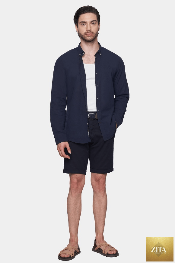 Navy Bright Moons summer shorts with relaxed fit and adjustable waistband, shown on a hanger.