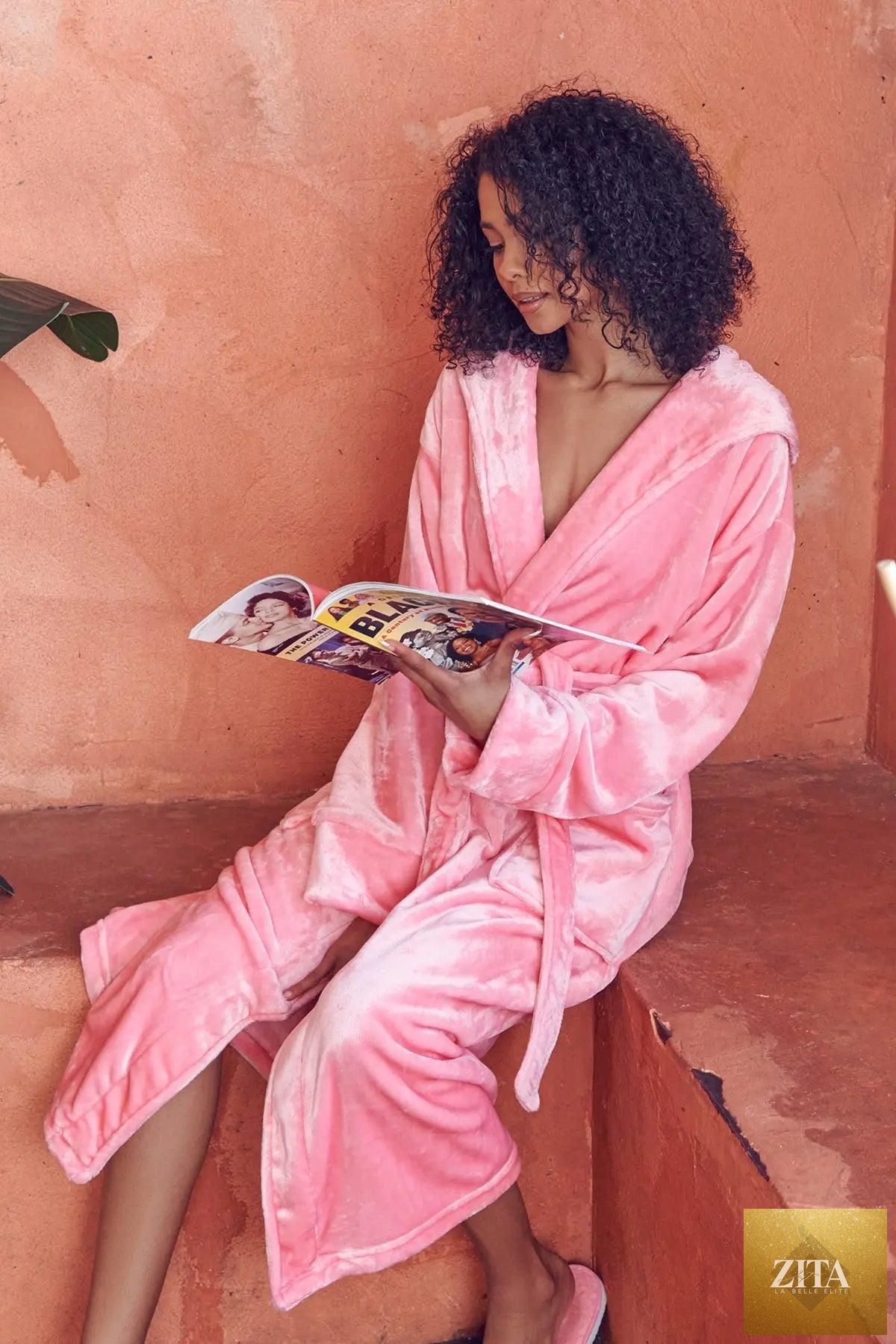 Pink women's plush hooded robe by Lotus Linen, featuring soft, cozy fabric and a comfortable hood, ideal for spa-like relaxation at home.