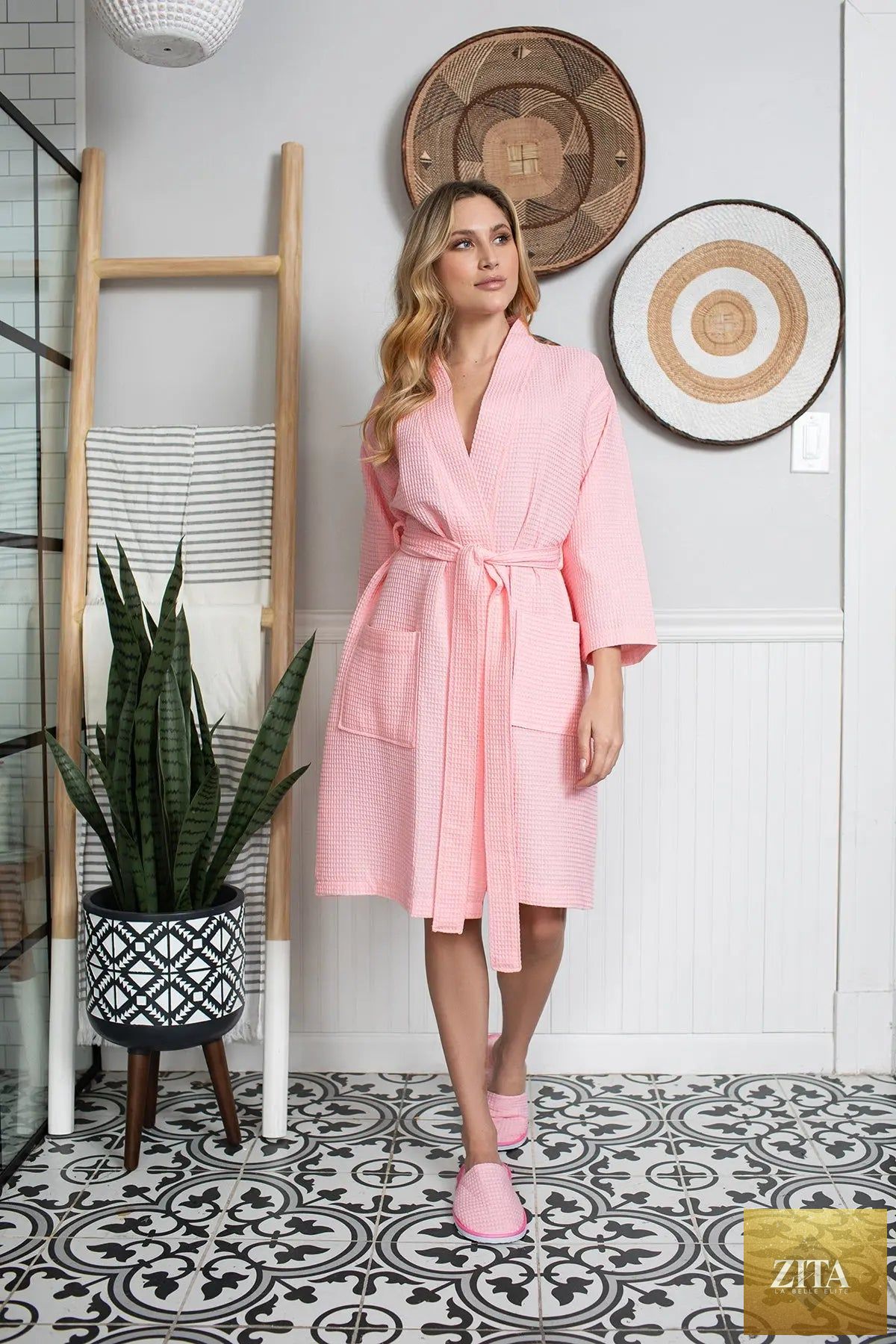 Pink knee-length waffle robe for women by Lotus Linen, soft and cozy with a relaxed fit, perfect for lounging and comfort.