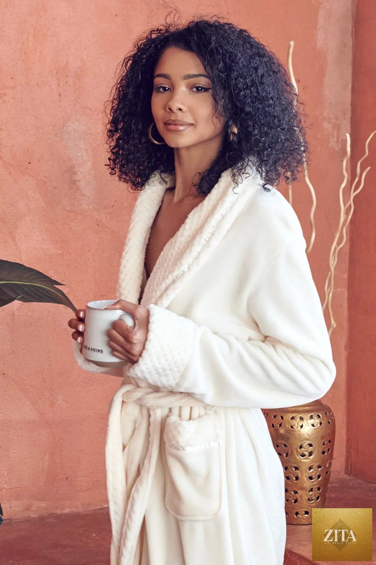 Women's ultra soft plush bathrobe by Lotus Linen, showing cozy, plush fabric with a relaxed fit and tie waist.