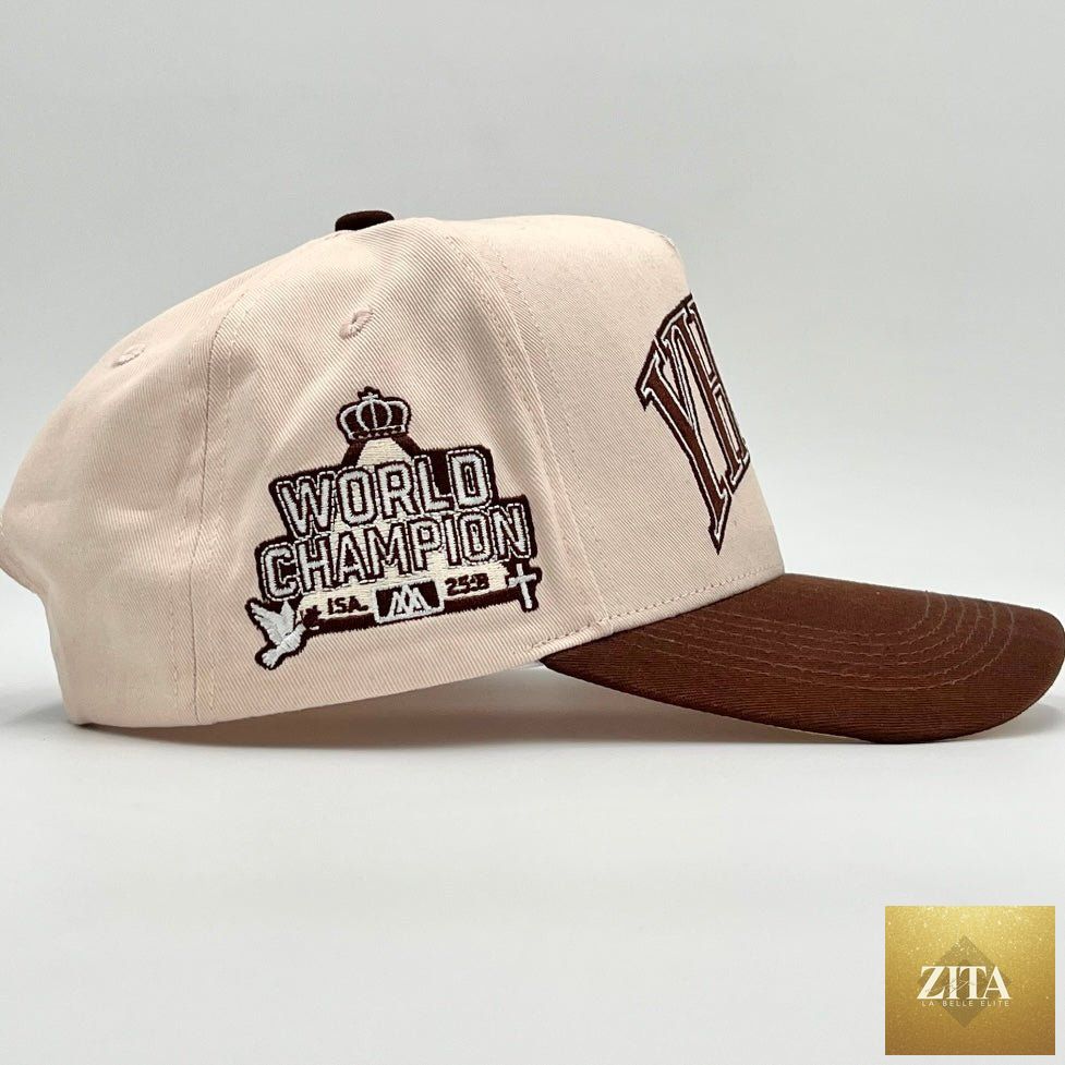 Cream and brown Malta Apparel YHWH structured snapback cap with a curved brim and adjustable strap.