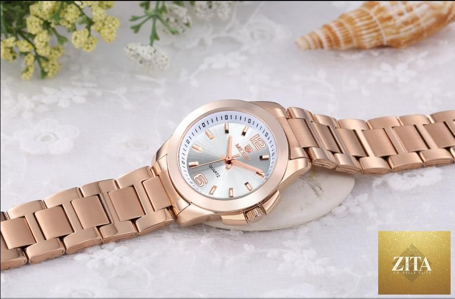 Elegant modern waterproof women's wristwatch by Stevvex with a gold rose design, stylish analog display, suitable for women.