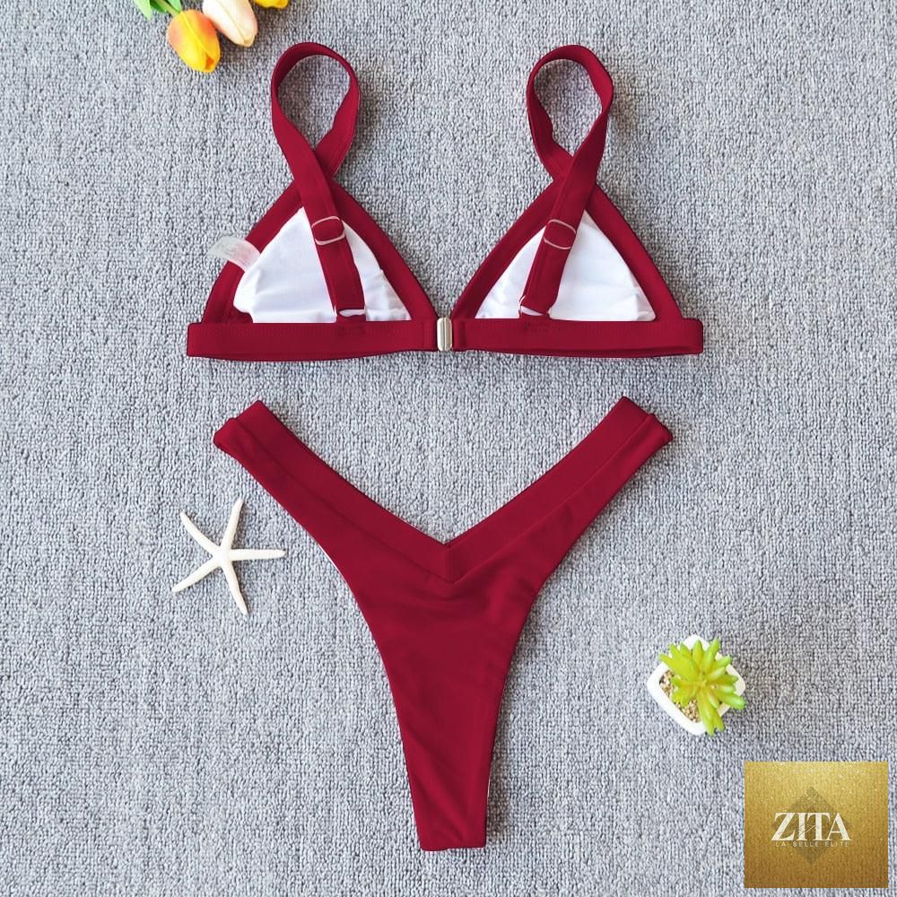 Stevvex solid bikini swimsuit for women featuring high-leg design, halter top, and patchwork pattern for summer beach swimming.
