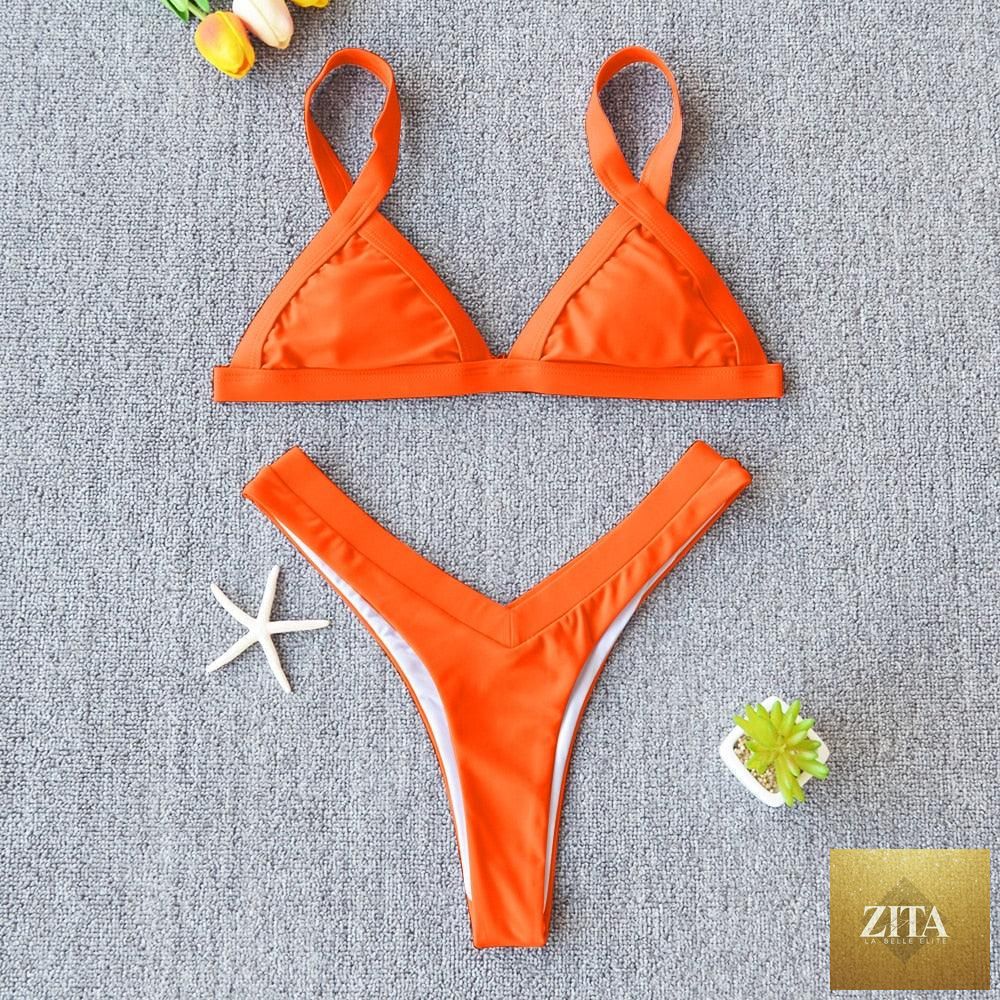 Stevvex solid bikini swimsuit for women featuring push-up design, high-leg cut, halter style, suitable for beach and swimming.