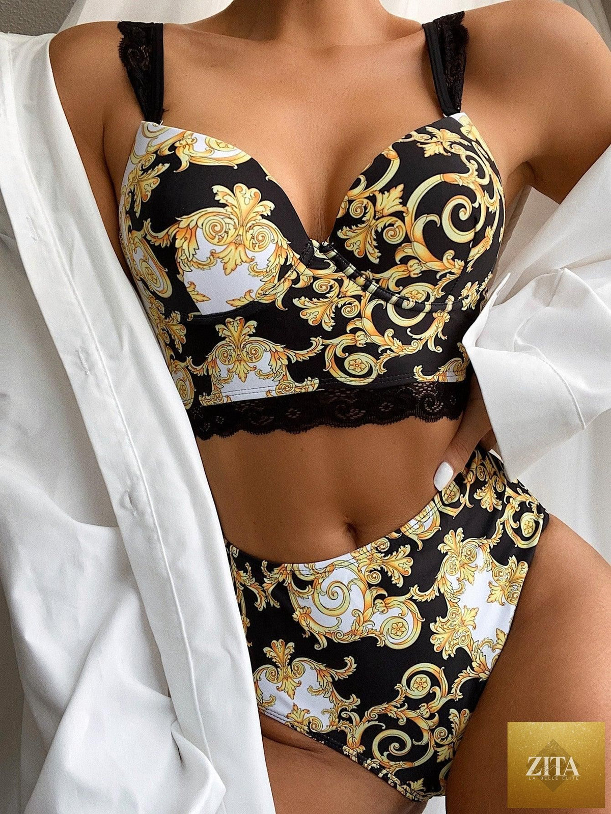Vintage black print women's bikini set with high waist bottoms, halter top, lace straps, padded bra, stylish beachwear by Stevvex.